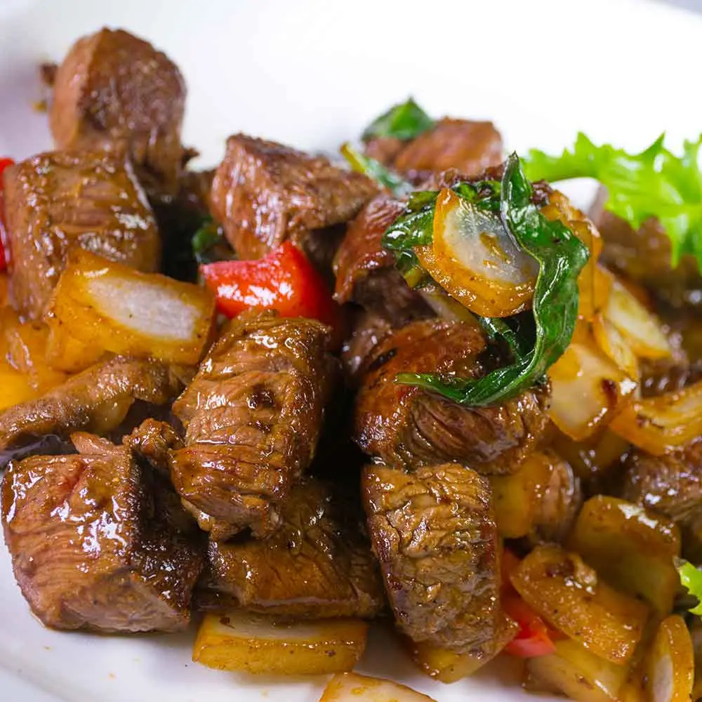 Filet mignon stir-fried w/onions, red pepper and basil